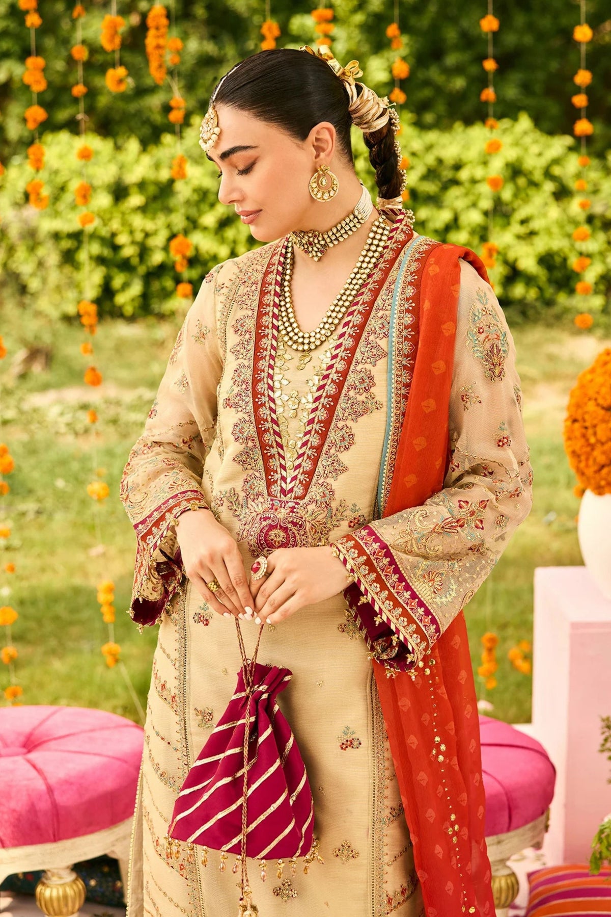 Festive women’s outfit in maroon for wedding party