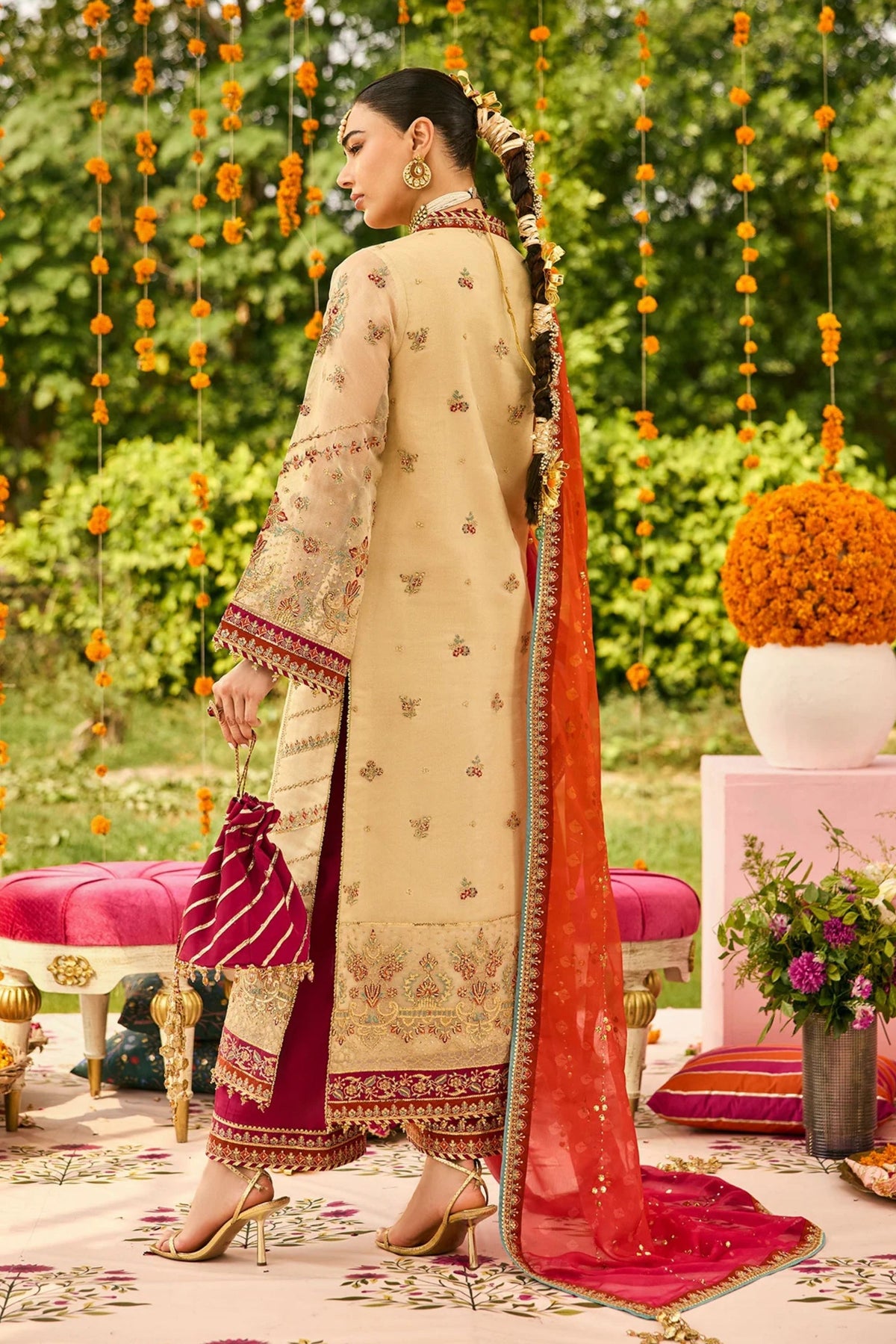 Festive women’s outfit in maroon for wedding party