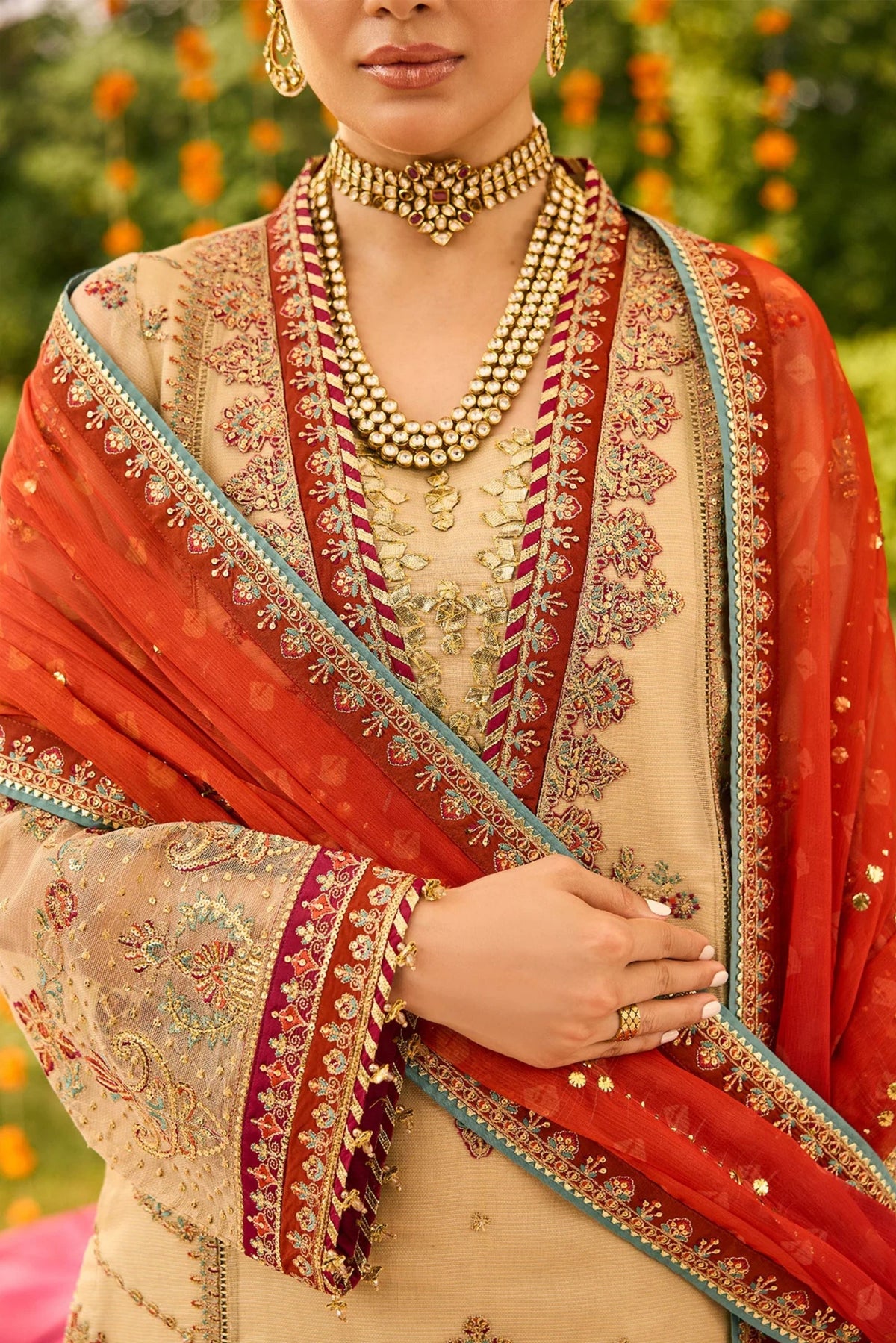 Festive women’s outfit in maroon for wedding party
